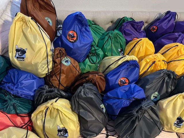 Colorful Big Marv's Legacy outreach bags prepared with donated supplies